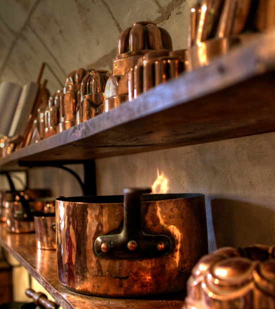 copper-pots-molds-on-shelf