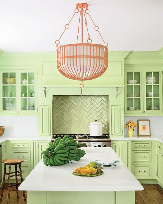 white-corian-countertops-light-green-cabinets