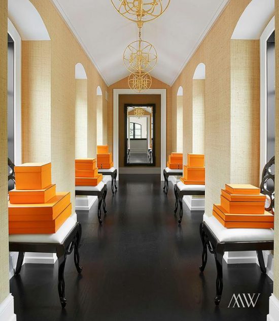 orange-and-black-hallway-hermes-box-black-stools-arched-windows