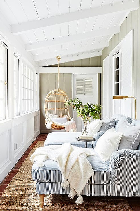 Long Sunroom with Hanging Rattan Chair