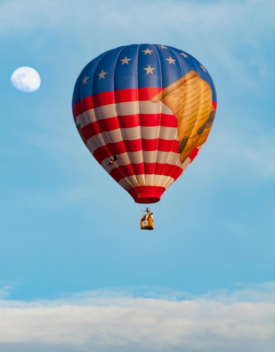 hot air balloon with the moon in the background