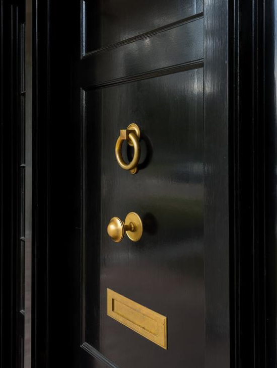 black-wooden-front-door-with-brass-mail-slot