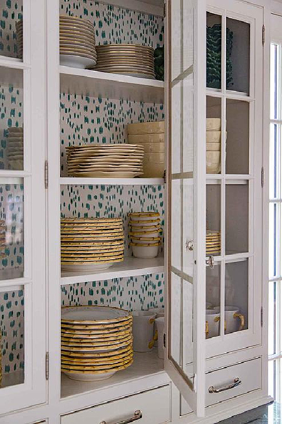 le-touche-wallpaper-on-back-of-glass-front-cabinets-lined