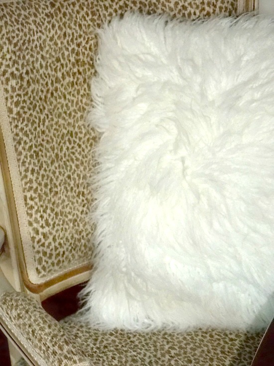 white-fur-throw-pillow-on-accent-chair