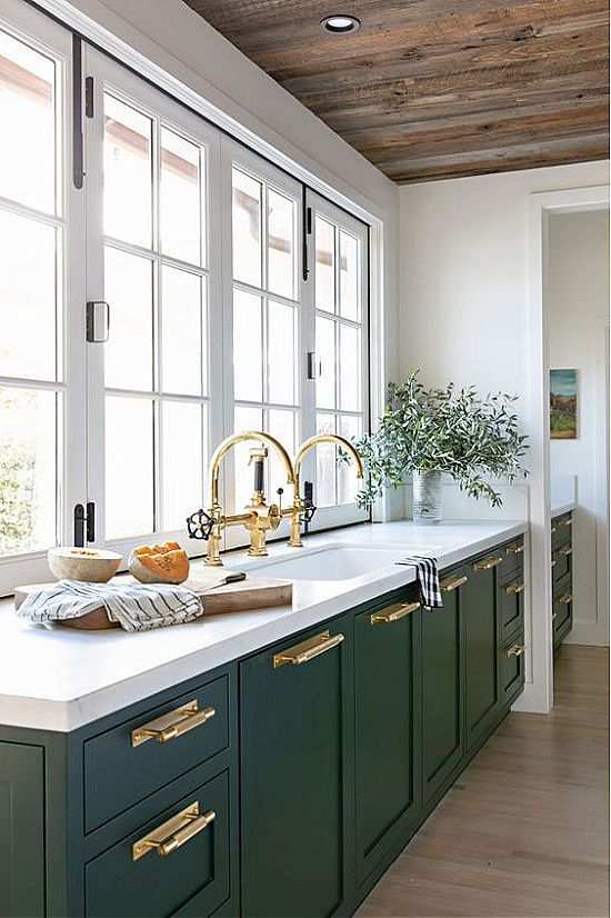 green-cottage-kitchen-cabinets-with-brass-pulls