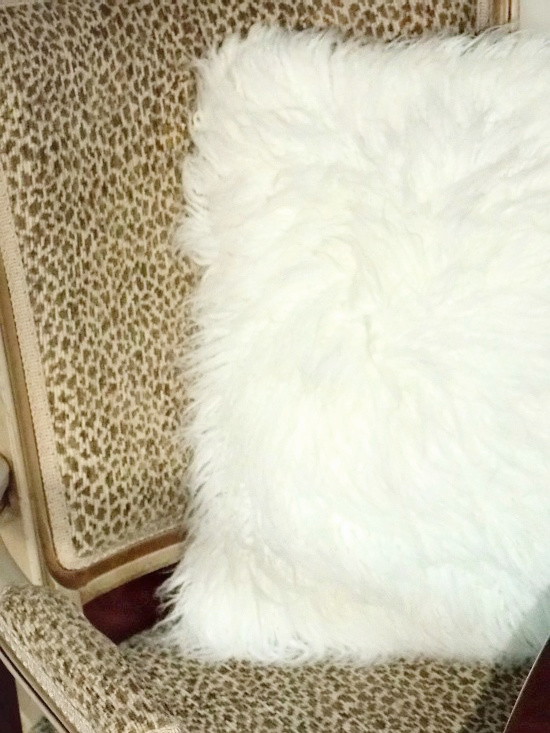 white-fur-throw-pillow-in-chair