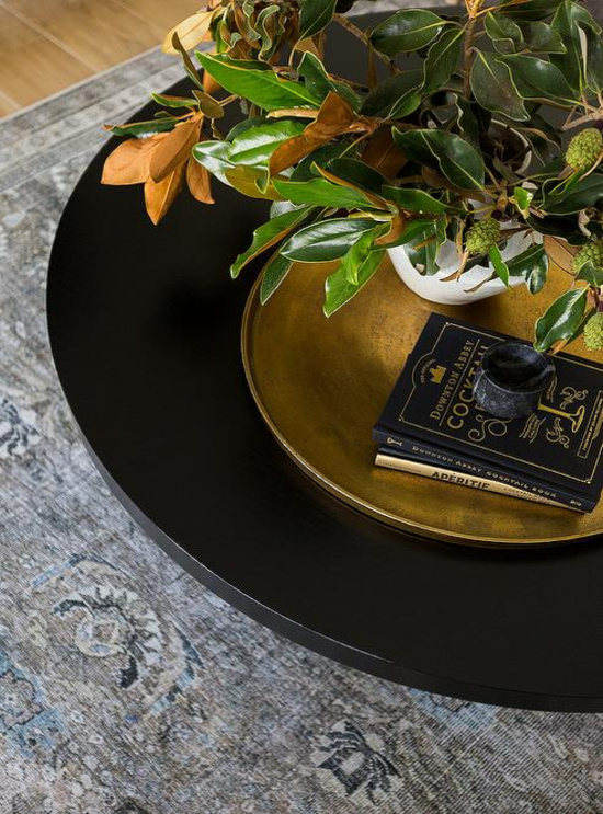 gold-bowl-on-black-coffee-table